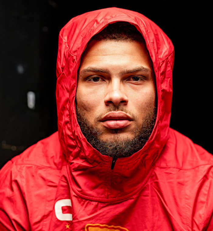 Portrait of Tyrann Mathieu, wearing red Chiefs hoodie